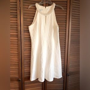 London Times white dress. Beaded neckline, peekaboo opening.